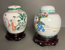 Two ginger jars Famille Verte lidded jars with stamps and blue rings to base Condition Report REPAIR