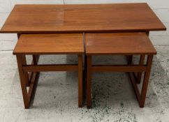 Teak nest of tables, one long coffee table with two matching tables under (Larges H44cm W100cm
