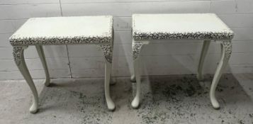 A pair of painted side tables with carved pierced edging depicting grapes and vines on cabriole legs