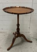 A mahogany pie crust tripod side table on carved splayed legs and turned support (H68cm Dia48cm)