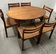 A set of six Danish teak and cord dining chairs in the style of Arne Hovmand Olsen for Mogens