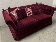 A deep red velvet sofa with drop sides (H79cm W220cm D108cm)