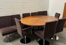 An oval dining table by Chilewich along with ten swivel chairs by the German manufacture Hulsta,