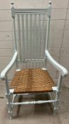 A painted farmhouse chair with stick back and rush seat