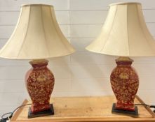 A pair of Chinese red table lamps
