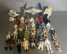 A selection of Star wars figures to include Han Solo, Leia and Luke along with Darth Vader's Tie