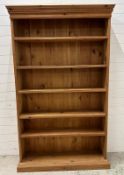A pine five shelf bookcase (H200cm W115cm D29cm)