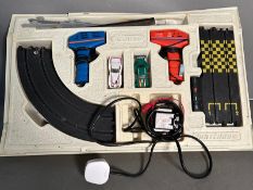 A Matchbox electric track set and two cars