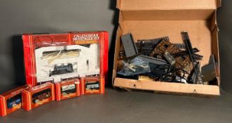 A Hornby railway Caledonian passenger set along with some loose track and rolling stock