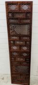 A wall hanging teak screen 46cm x 180cm