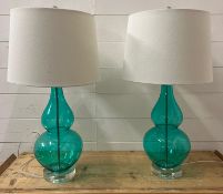 A pair of glass curved table lamp in teal