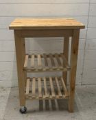 An Ikea kitchen trolly with two slate shelves on castors (H85cm W58cm D51cm)