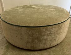 A large circular green upholstered pouffe H40cm Dia120cm