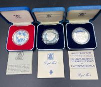 A selection of three silver proof coins: 1977 Silver Jubilee, and two commemorating the marriage