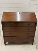 A mahogany four drawer bureau, the fall opening to drawers and storage (H107cm W99cm D48cm)