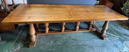 A large oak farmhouse dining table with baluster legs (H77cm W280cm D100cm)