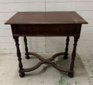 A Georgian style oak single drawer side table on turned legs with cross stretcher