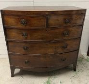 A bow fronted chest of drawers. Height 105cm. 107x54