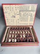 A Chinese red chess set in the form of a book