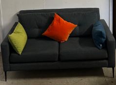 A contemporary charcoal grey two seater sofa with button back cushions (scatter cushions are not