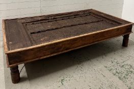 A reclaimed Indian door converted into a coffee table (H46cm W203cm D116cm)