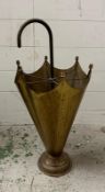 A brass stick stand in the shape of an umbrella