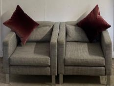 A pair of grey and blue flecked arm chairs on chrome legs (scatter cushions are not included in this