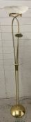 A floor standing brass style lamp