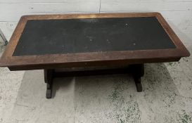 An oak library table with leather top and drawer to one end (H77cm W160cm D66cm)