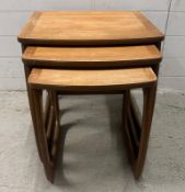 A nest of three mid century teak tables by Nathan. Height 50. 53x48