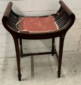 An Edwardian music stool, crackle seat on tapering legs in need of reupholstery (H73cm W56cm)
