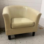 A white faux leather tub chair.