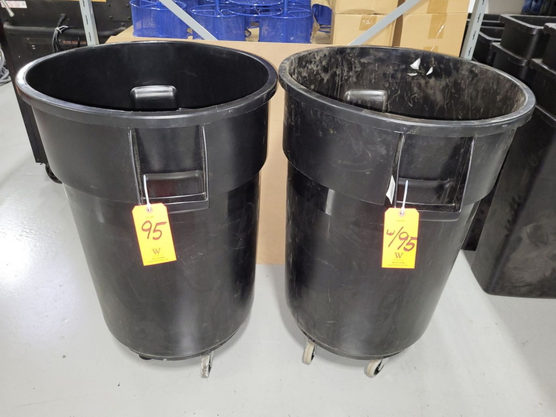 Lot - (2) 44-Gallon Poly Trash Cans; Both Include Dolly