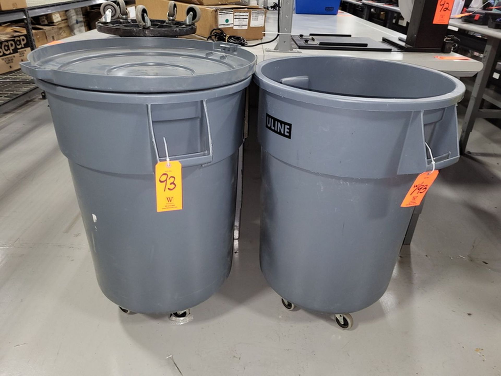 Lot - (2) Uline 55-Gallon Poly Trash Cans; Both Include Dolly, (1) Lid