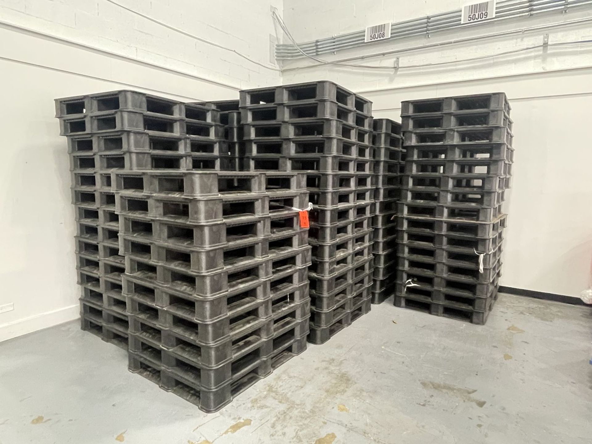 Lot - (98) 40 in. x 48 in. x 6 in. high Black Plastic Pallets