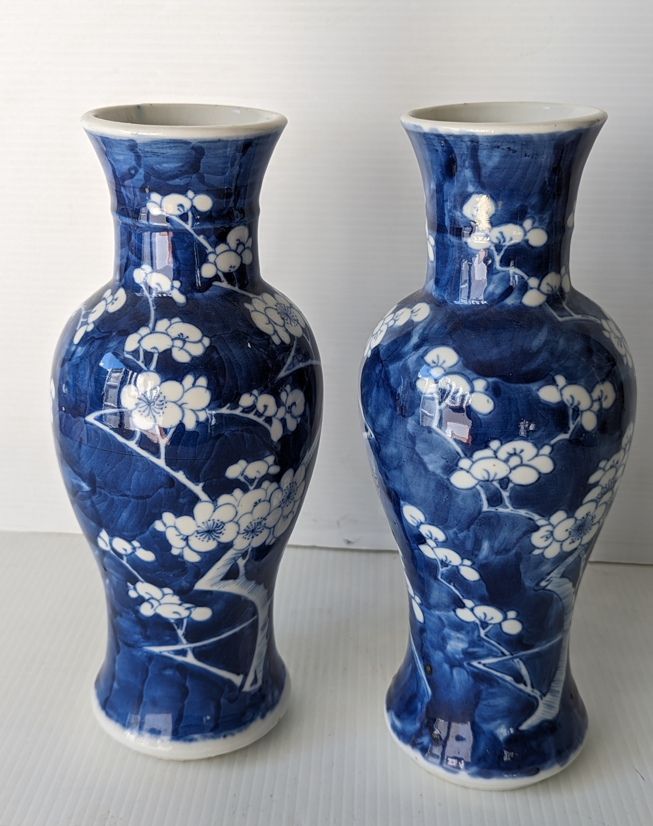 A pair of late 19th century Chinese blue and white porcelain vases with prunus decoration 