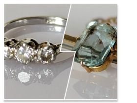 A three-stone graduated diamond ring on a platinum setting, size M,