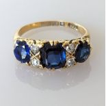 An Edwardian sapphire and diamond ring on an 18ct gold setting