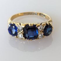 An Edwardian sapphire and diamond ring on an 18ct gold setting