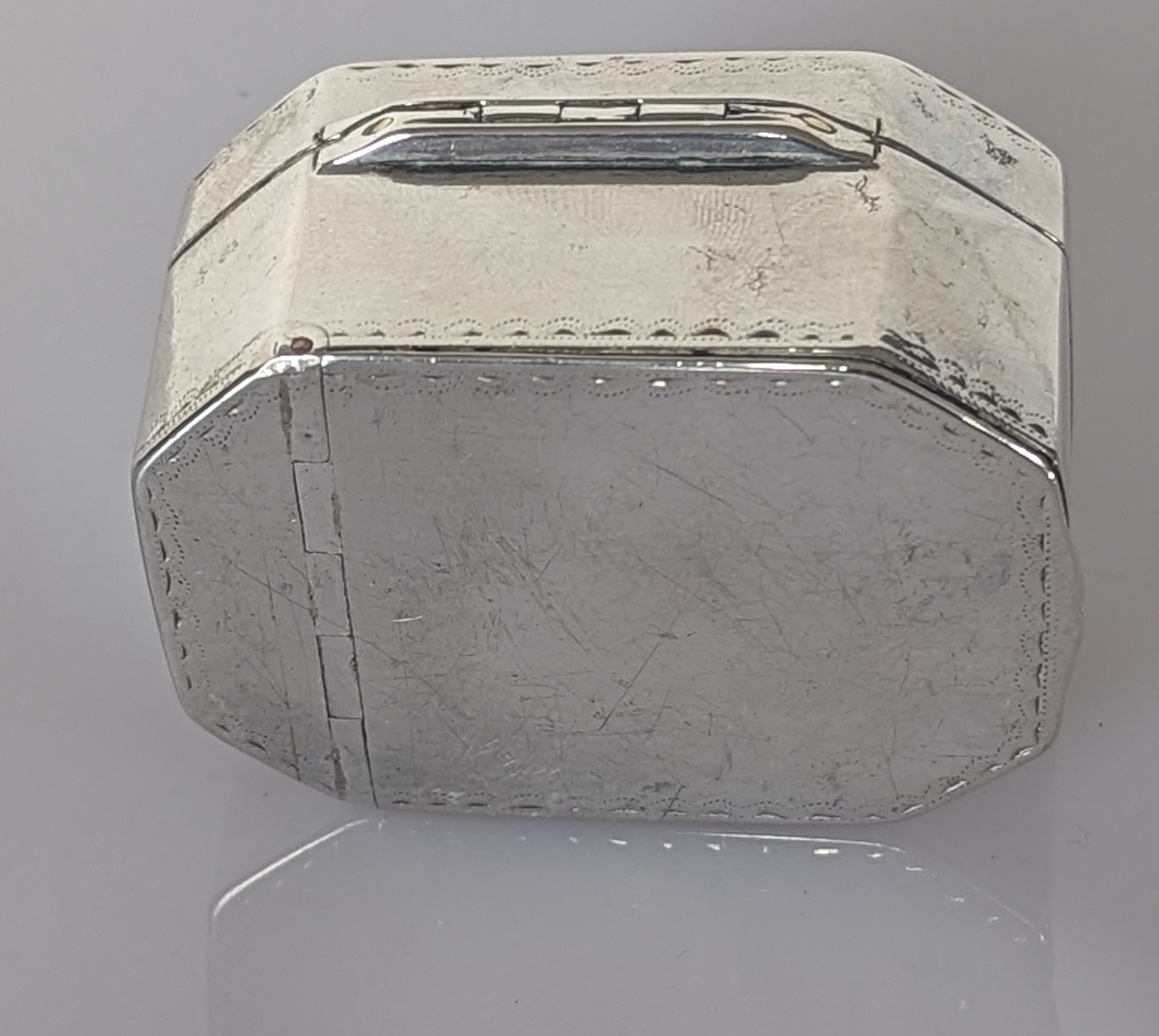 A George III silver double hinged nutmeg grater with bright-cut decoration, crest to lid, stamped R - Image 3 of 6