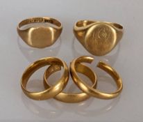 Three 22ct yellow gold wedding bands, two cut, other size L, 4mm, 14.7g and two 18ct yellow gold 