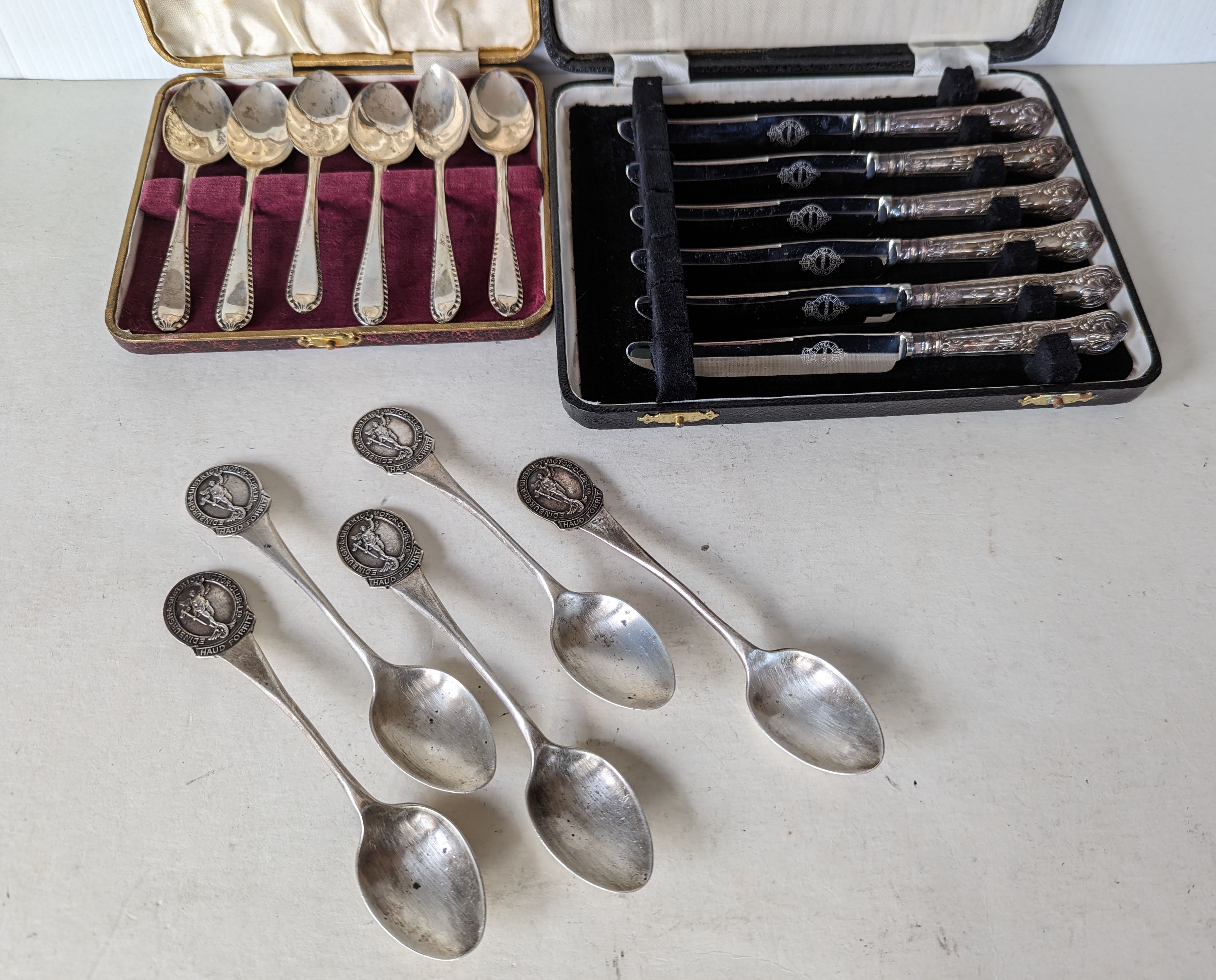 A cased set of six silver coffee spoon by Viners, Sheffield; five silver tea spoons with crested ter - Image 2 of 3