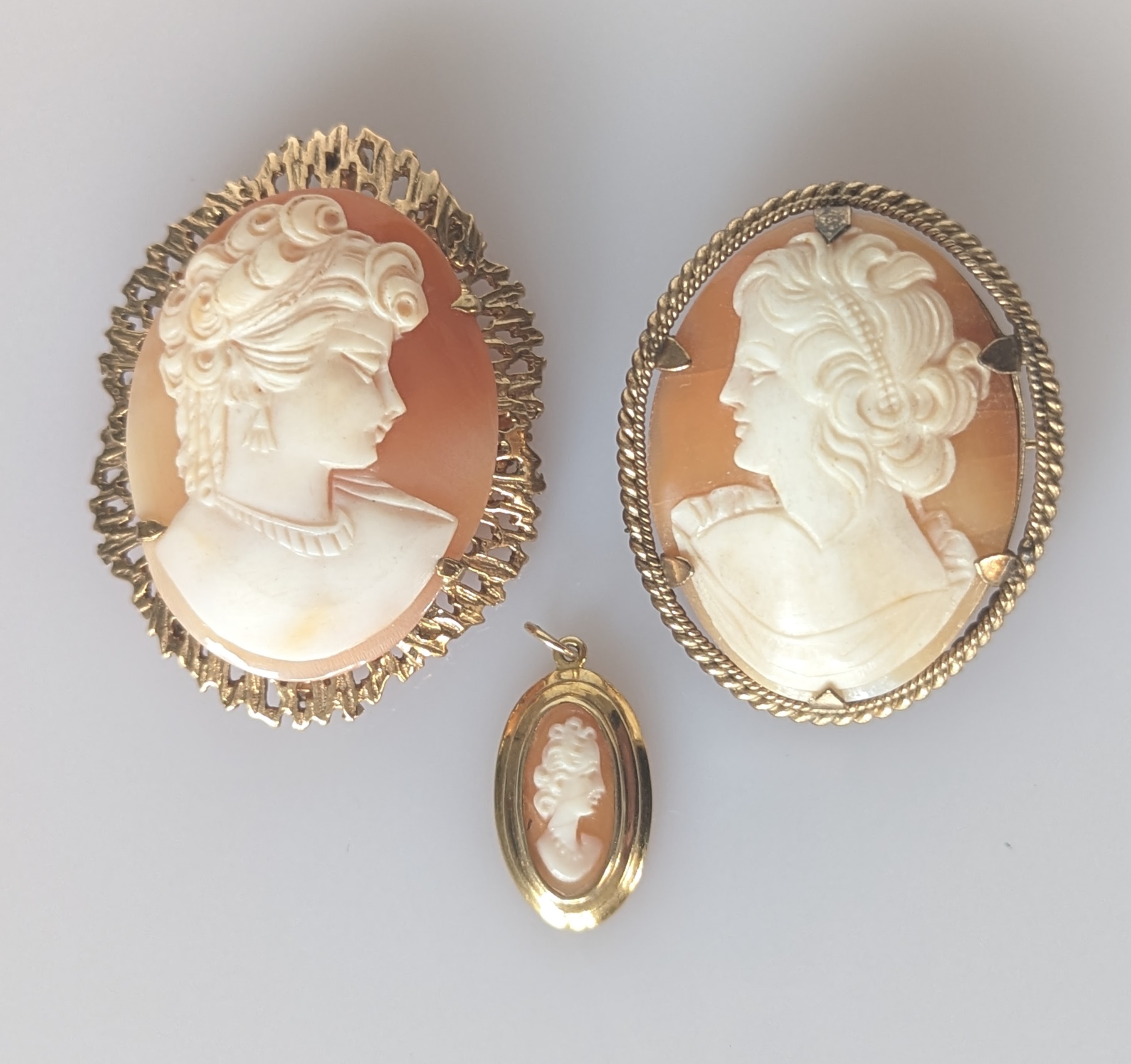 A cameo brooch and a pendant set in 9ct yellow gold, 45mm, 20mm, both hallmarked, 13.6g and another 