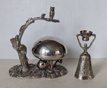 An Edwardian silver plated table bell, in the form an owl perched on a branch 