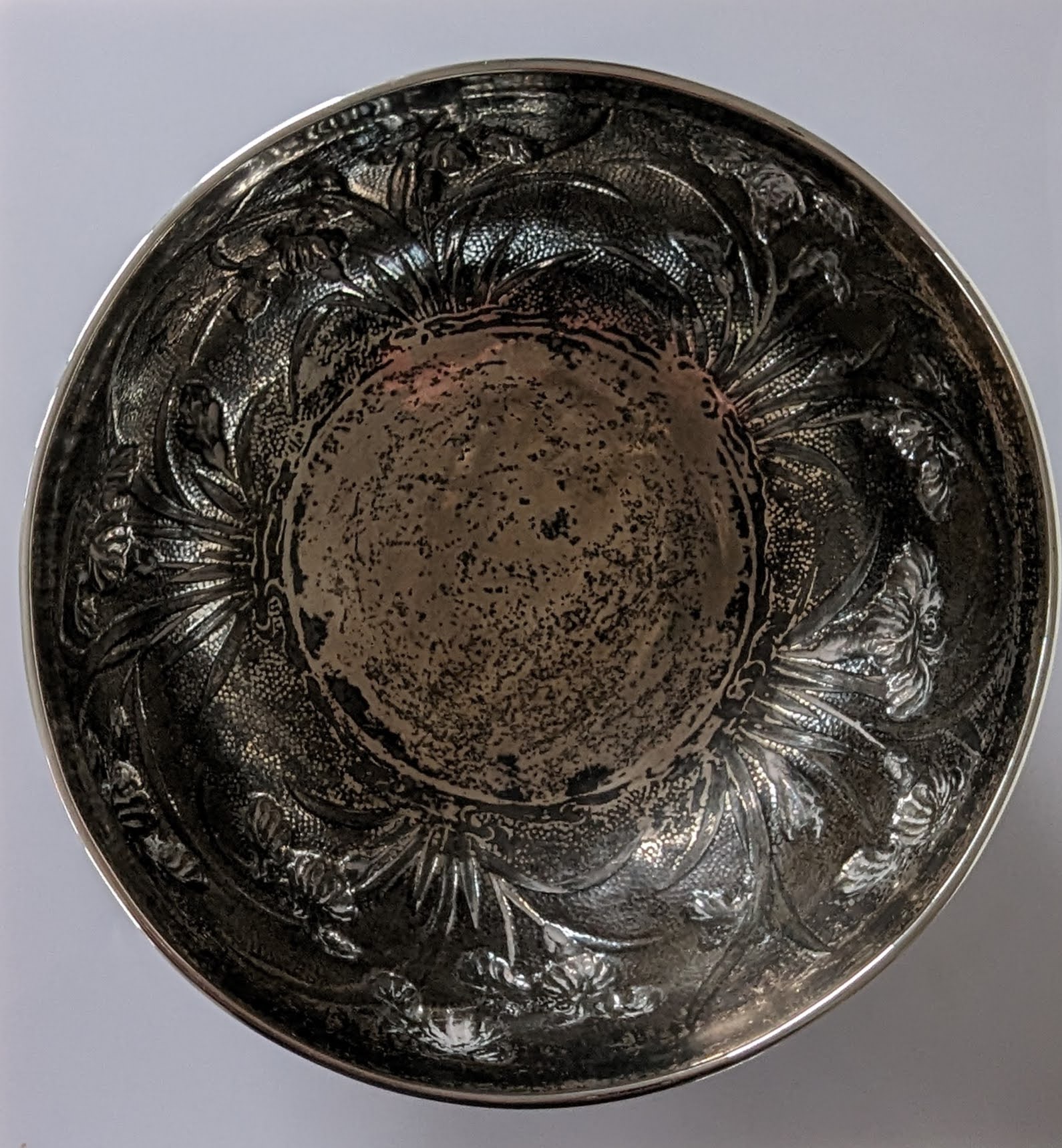 A Chinese silver circular bowl with banded rim, embossed flowers on a planished ground - Image 2 of 4