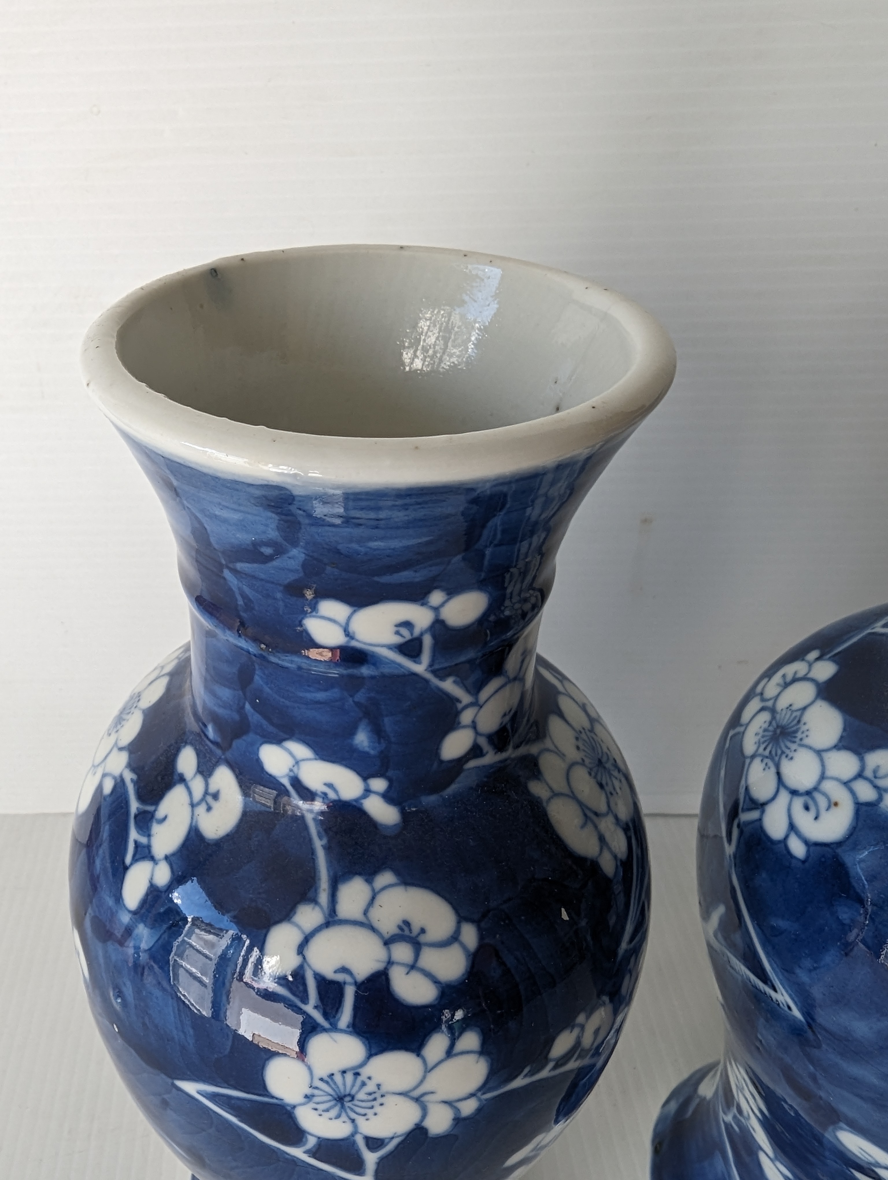 A pair of late 19th century Chinese blue and white porcelain vases with prunus decoration  - Image 6 of 6