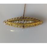 A Victorian-style  yellow gold bar brooch with pave-set round-cut diamonds, largest 0.15 carats