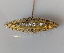 A Victorian-style  yellow gold bar brooch with pave-set round-cut diamonds, largest 0.15 carats