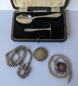 A cased George V silver christening set hallmarked for William Suckling Ltd., Birmingham, 1934;