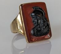 A carnelian cameo ring depicting a centurion on a 9ct gold mount, 23 x 15mm, hallmarked, 12g 